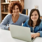 a mother with her special needs child on her laptop